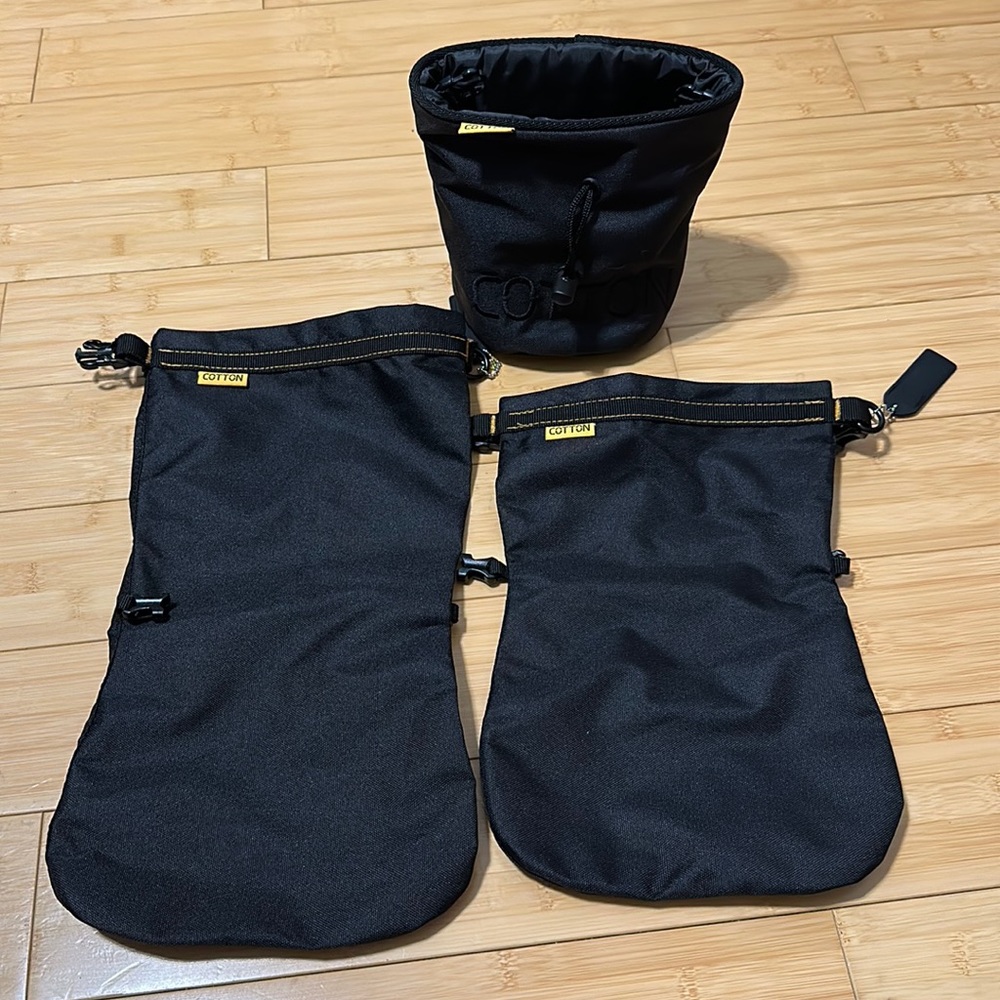 Bundle of Waterproof drybags and bucket camera lenses.